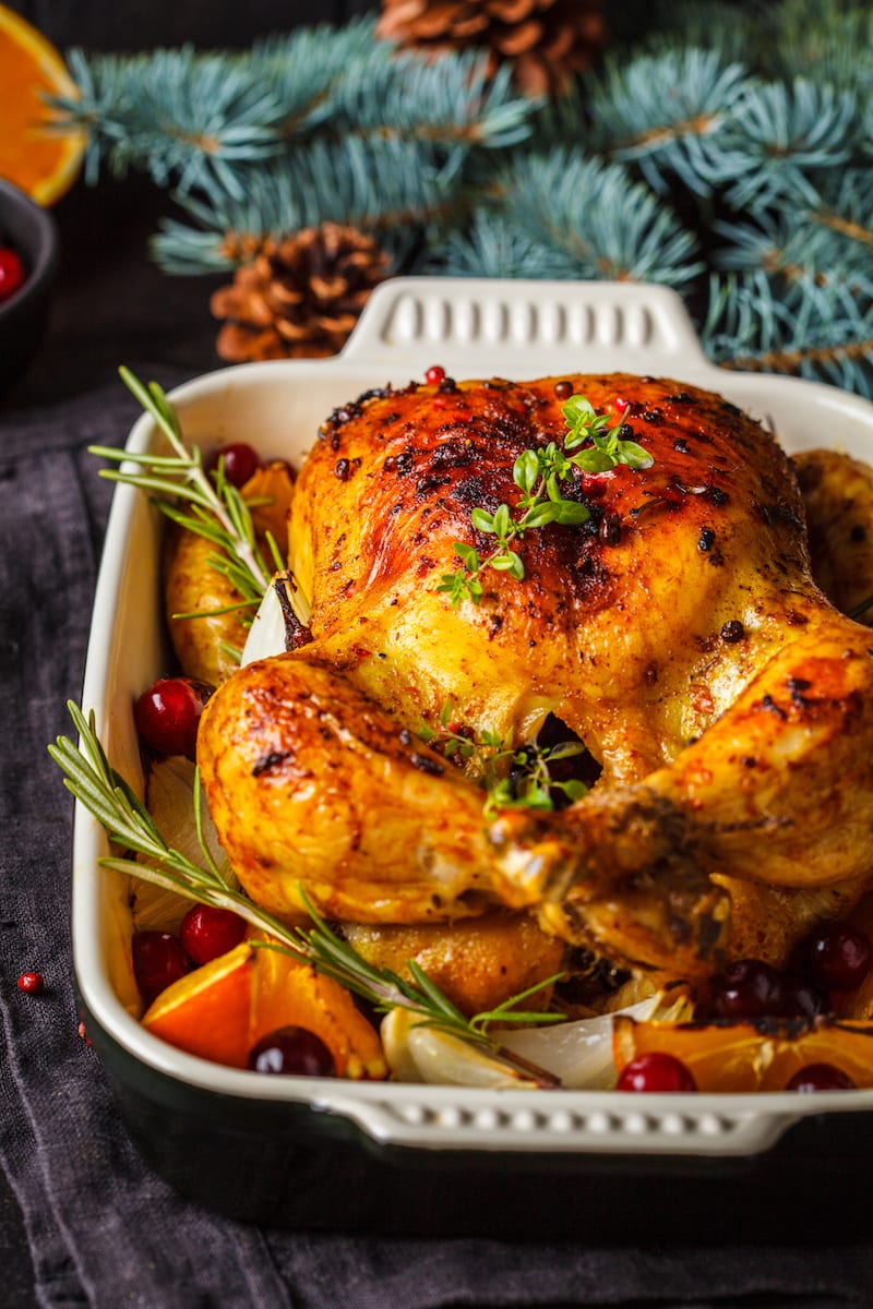 Christmas roasted chicken with cranberries, orange, spices and herbs ...
