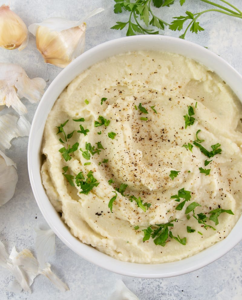This garlic cauliflower mash recipe takes classic “faux-tatoes” and revamps them to make an entirely dairy-free side to enjoy with any meal.