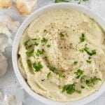 This garlic cauliflower mash recipe takes classic “faux-tatoes” and revamps them to make an entirely dairy-free side to enjoy with any meal.