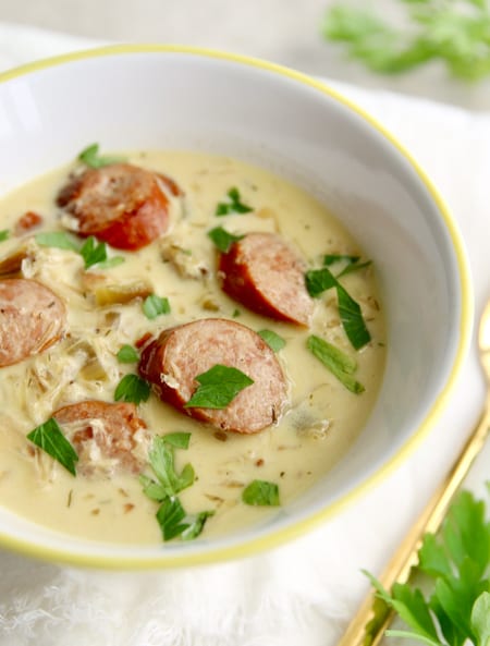This creamy sauerkraut and sausage soup is an easy and flavorful recipe made with smokey polish sausage and briney sauerkraut.