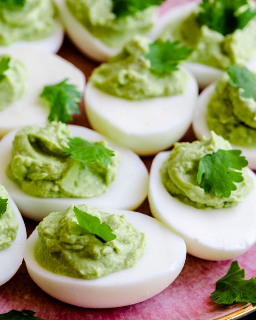 a picture of green avocado filled deviled eggs